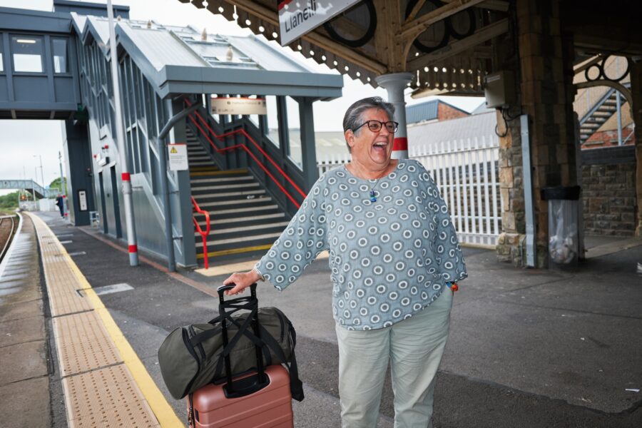 Woman waiting for a train in station